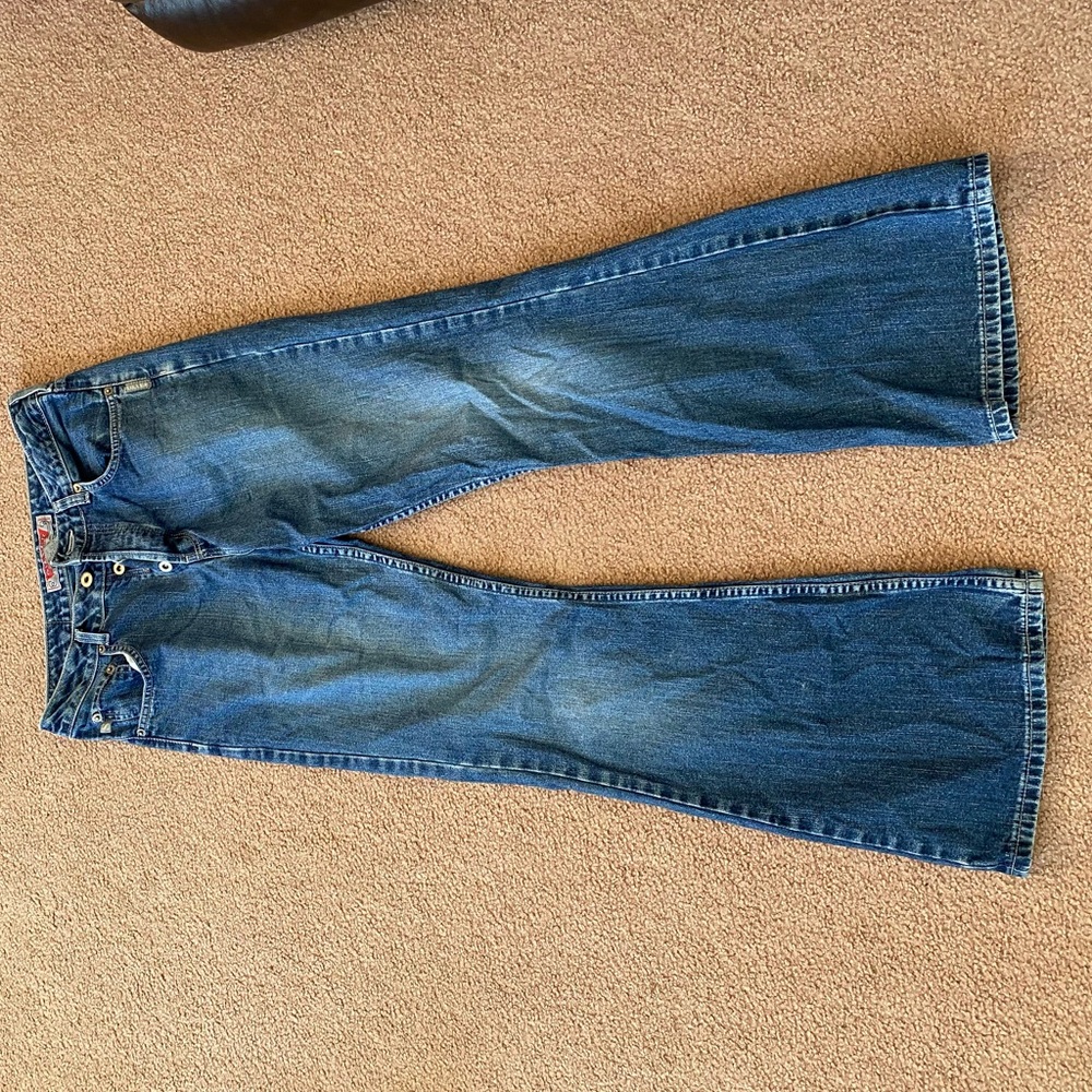 Vintage silver boot cut jeans with buttons instead of a zipper